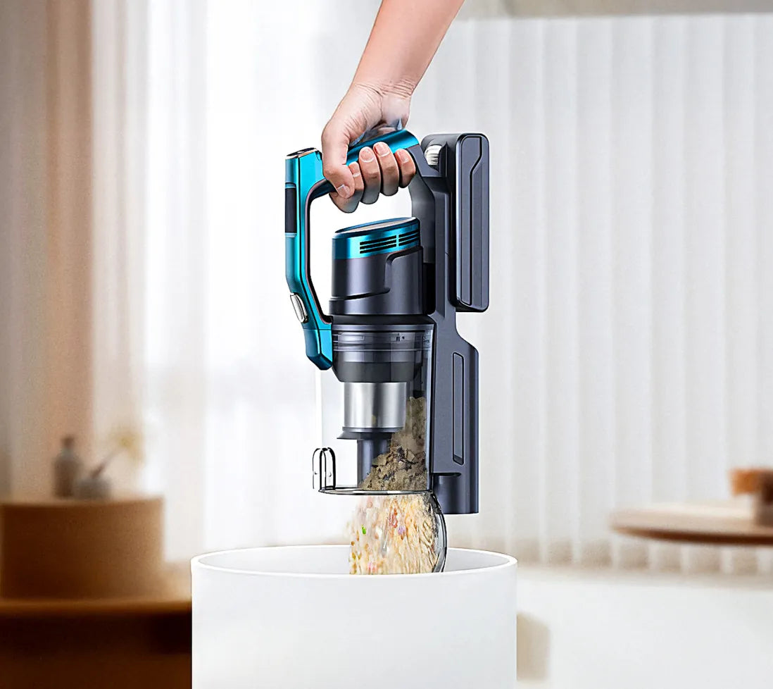 Hand rinsing a black electric shaver under a faucet in a sink.